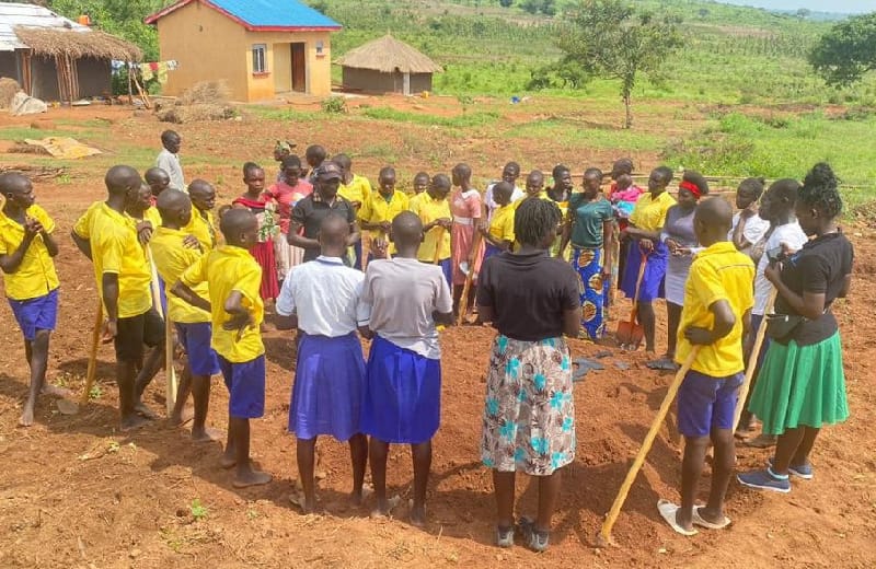 with learners in Imvepi during a community led approach in environmental protetction by estatblishing tree nurseries in schools in Imvepi refugee settlement  