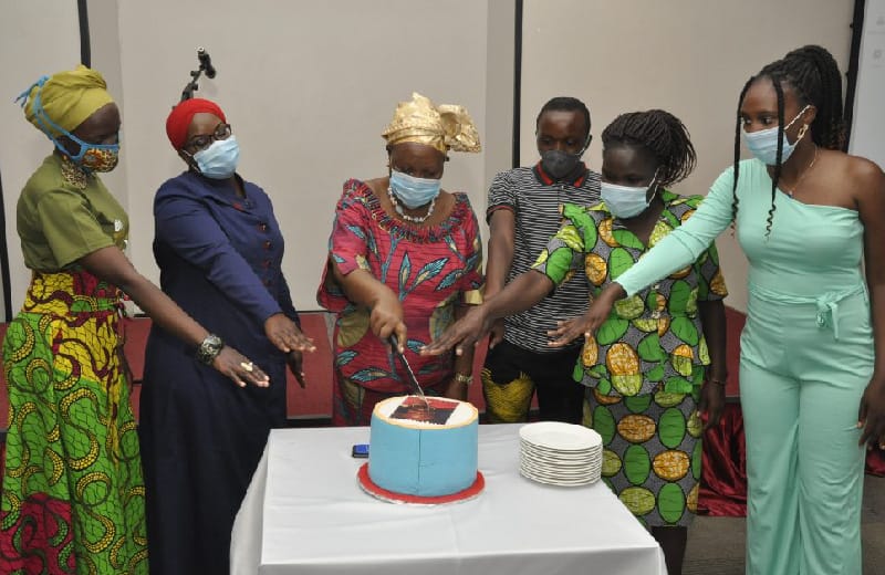 Dr. Hilda Tadria serves cake